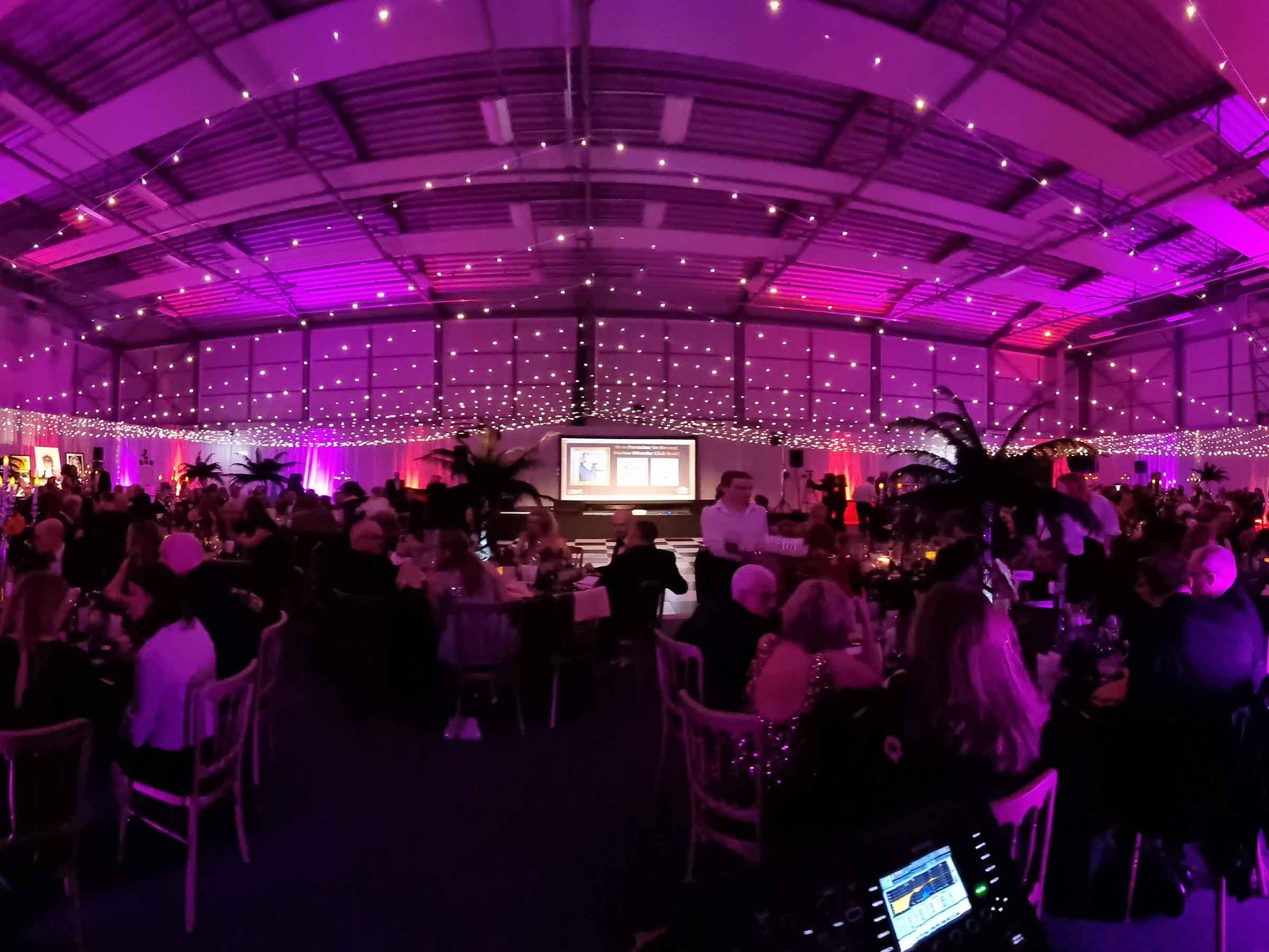 An elegant ball illuminated with professional lighting and sound
