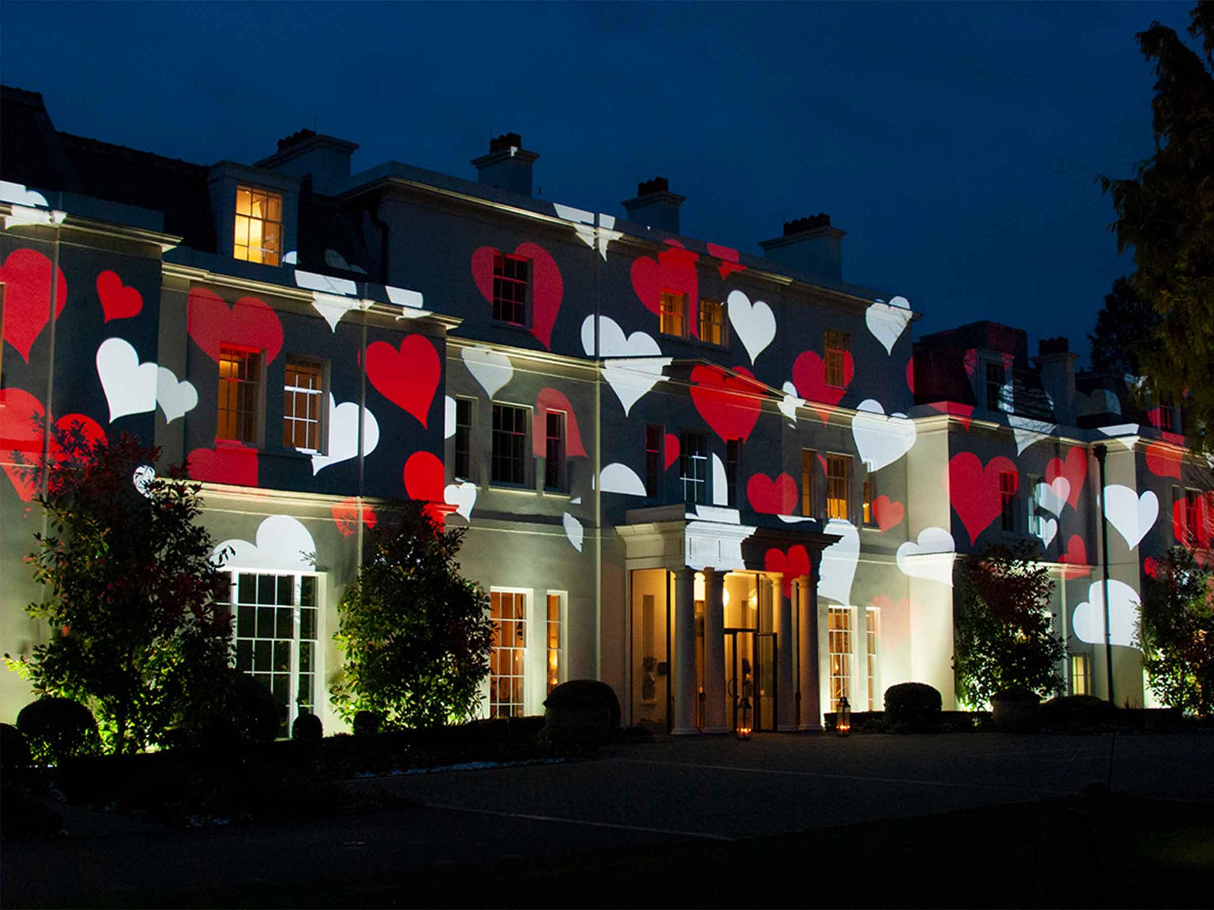 A grand building façade transformed by large-scale projection